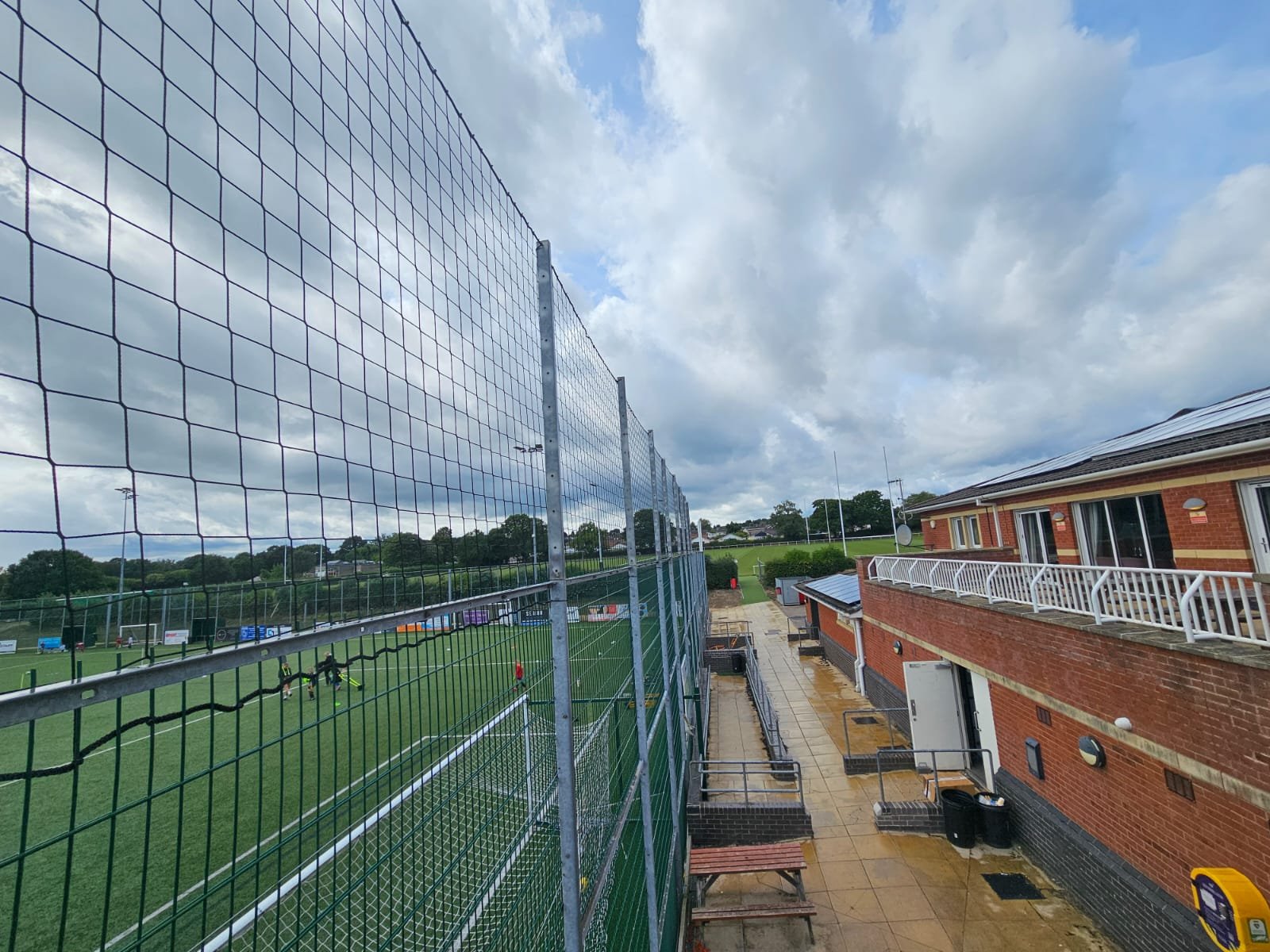Perimeter Ball Stop Netting installed around an outdoor football pitch
