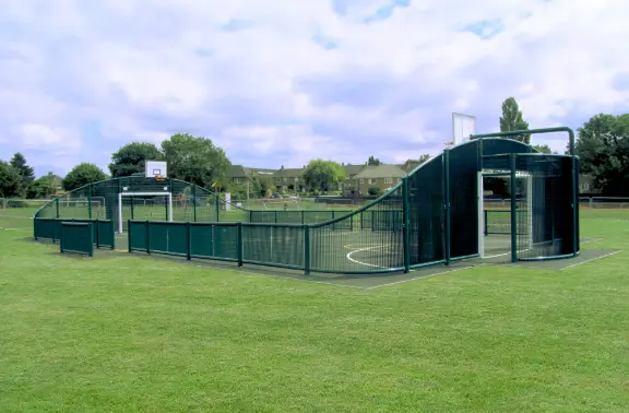 Arched MUGA with curved back goal ends and sports fencing
