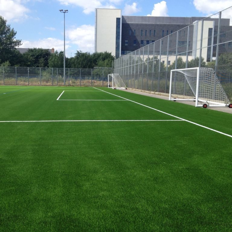 Synthetic turf sports surfacing installed on an outdoor sports facility